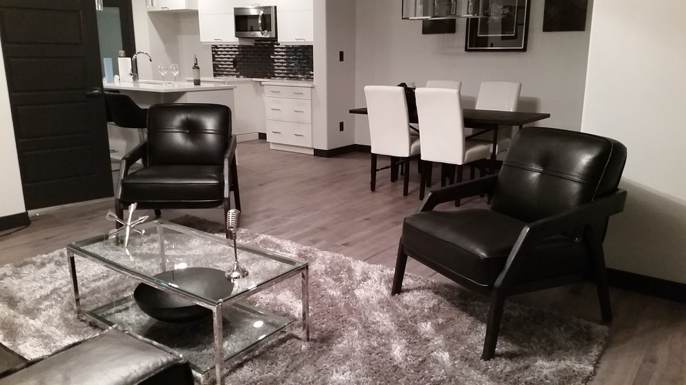 Photo of a small modern formal open plan living room in Edmonton with black walls, vinyl flooring, no fireplace and no tv.