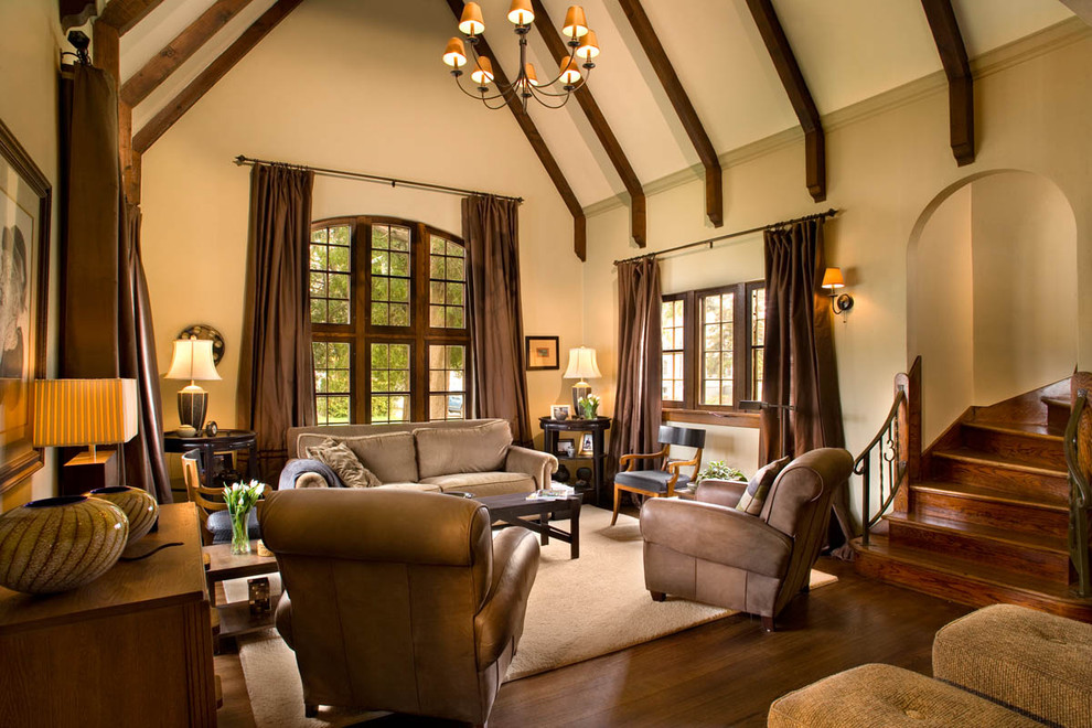 Example of a large classic formal and open concept dark wood floor and brown floor living room design in Milwaukee with beige walls and no tv