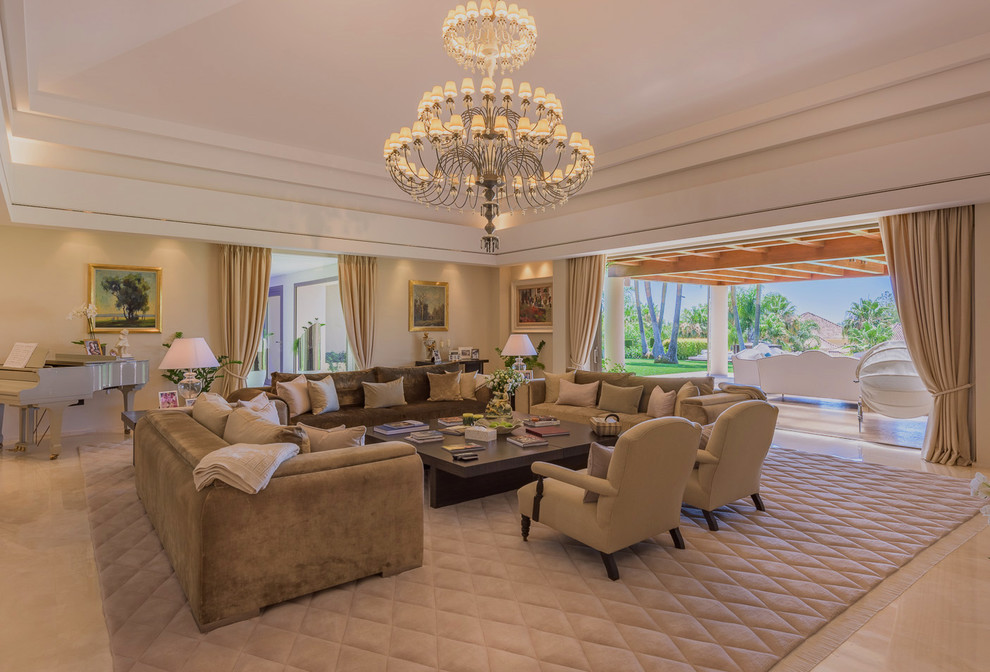 Example of a huge classic formal and open concept marble floor and beige floor living room design in Malaga with beige walls, no tv and no fireplace