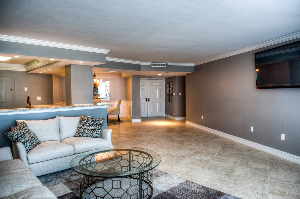 На фото: парадная, открытая гостиная комната среднего размера в стиле ретро с серыми стенами и полом из керамической плитки с