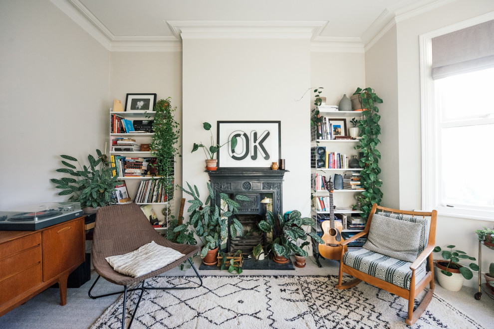 Inspiration for a medium sized scandi formal enclosed living room in Kent with white walls, carpet, a standard fireplace, a metal fireplace surround, no tv and beige floors.