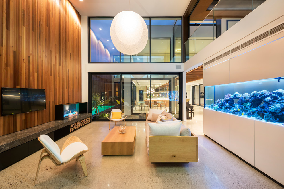 Großes, Repräsentatives Modernes Wohnzimmer im Loft-Stil mit Betonboden, Tunnelkamin, Kaminumrandung aus Metall, TV-Wand und grauem Boden in Melbourne