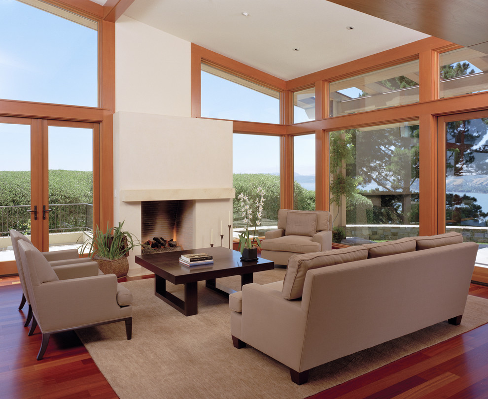 This is an example of a contemporary living room in San Francisco with a standard fireplace.