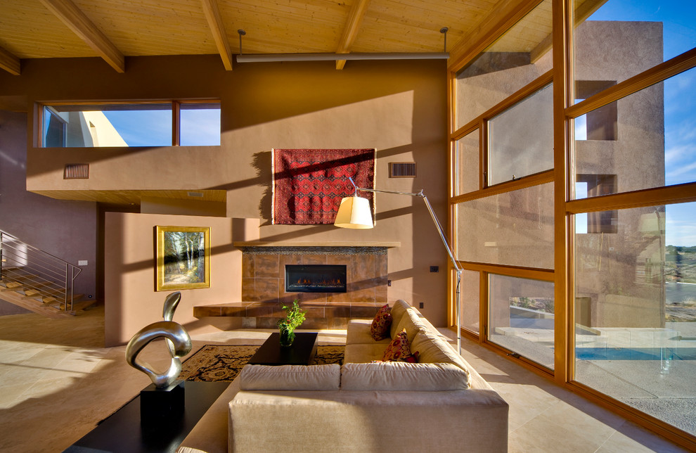 This is an example of a large contemporary open plan living room in Albuquerque with a ribbon fireplace and a plastered fireplace surround.