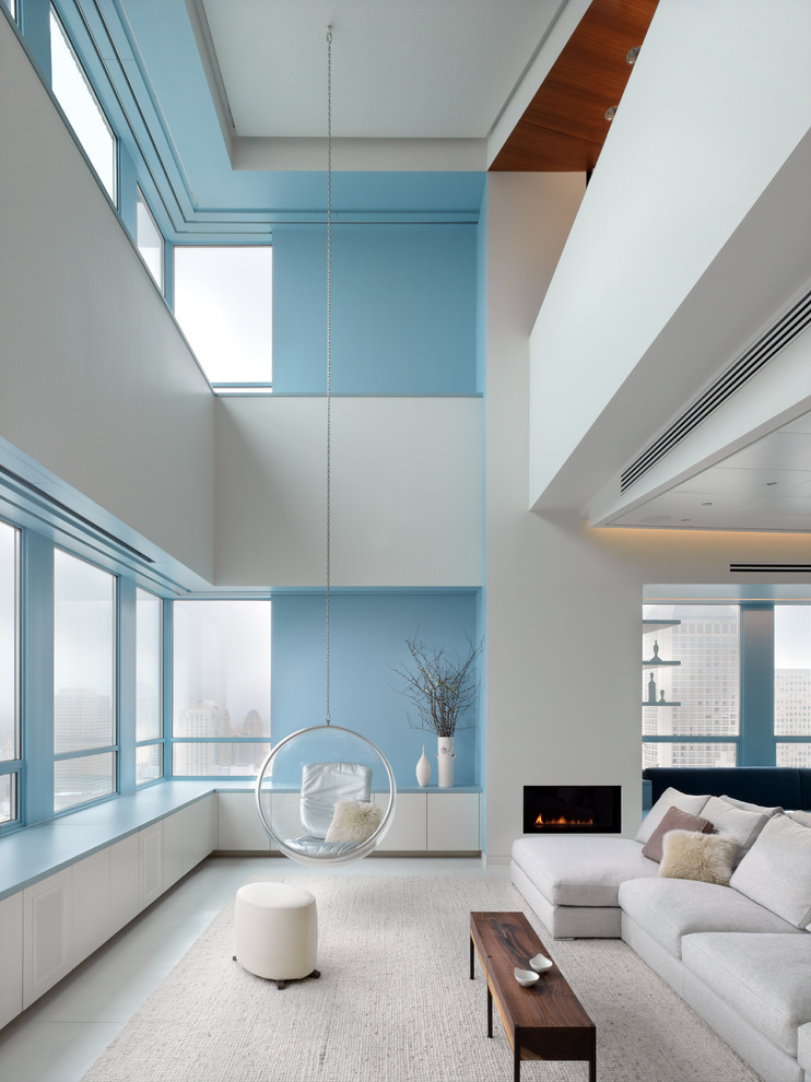 Living room - modern living room idea in San Francisco with blue walls and a ribbon fireplace