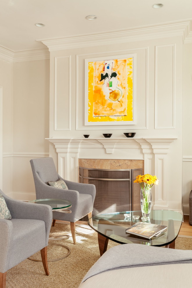 Transitional medium tone wood floor living room photo in Boston with white walls and a standard fireplace