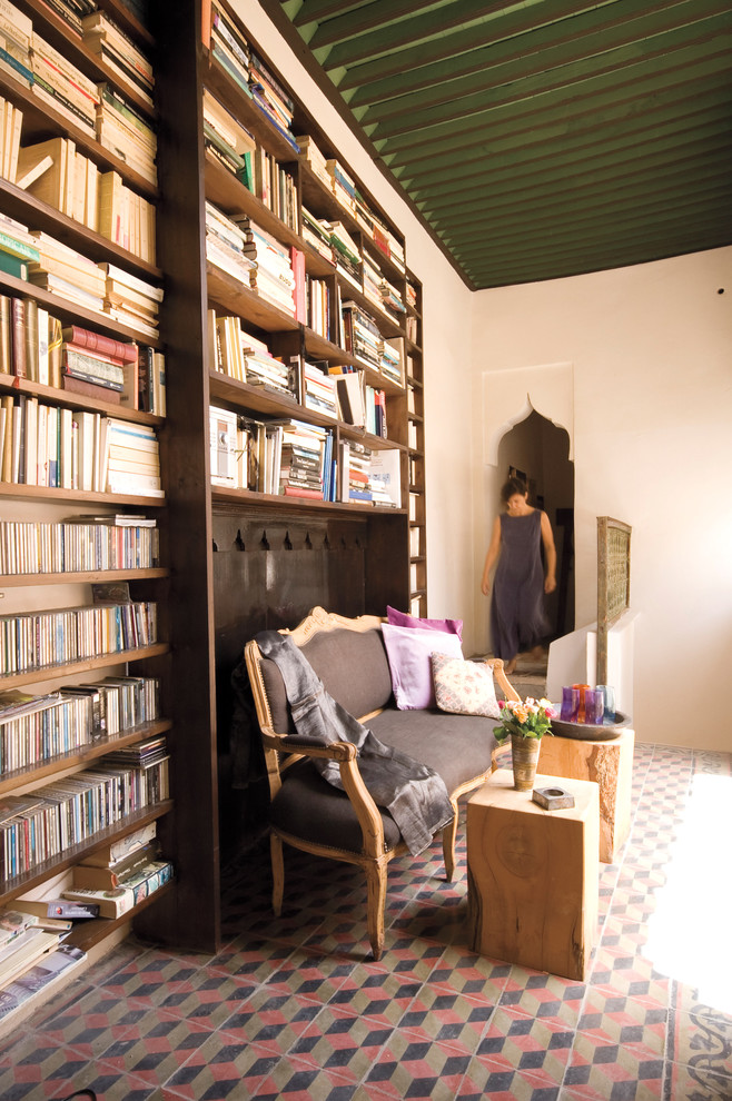 Inspiration for a mediterranean enclosed living room library remodel in New York