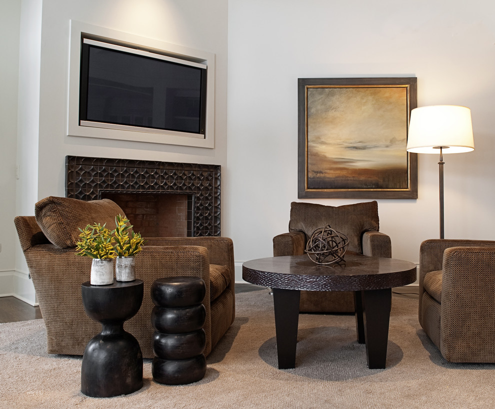 This is an example of a small transitional open concept living room in Chicago with medium hardwood floors, a tile fireplace surround and a wall-mounted tv.