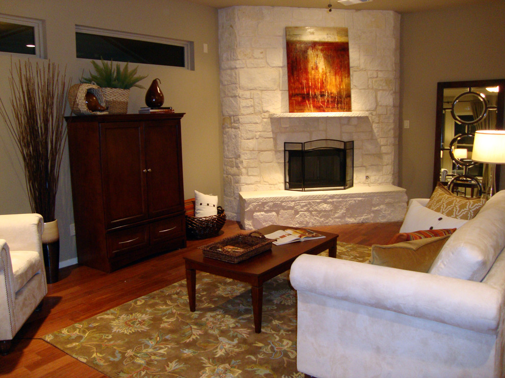 Living room - mid-sized transitional open concept medium tone wood floor living room idea in Dallas with beige walls, a corner fireplace, a stone fireplace and a corner tv