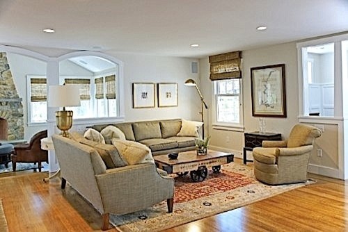 Living room - transitional formal and open concept medium tone wood floor living room idea in Boston with white walls, a standard fireplace and a stone fireplace