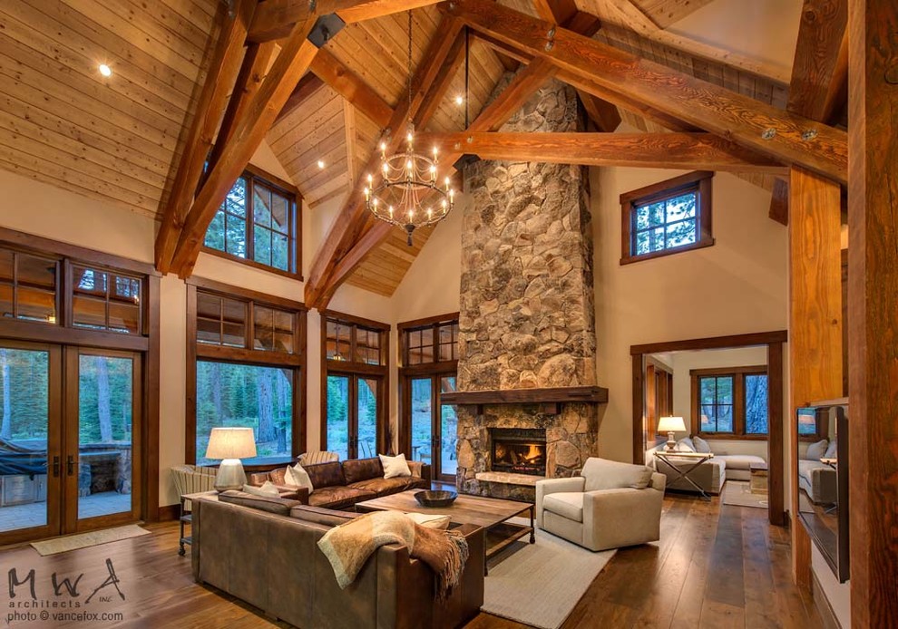 Living room - mid-sized craftsman open concept and formal medium tone wood floor and brown floor living room idea in Other with beige walls, a standard fireplace, a stone fireplace and a wall-mounted tv