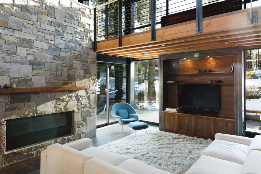 Rustic living room in San Francisco with a stone fireplace surround.