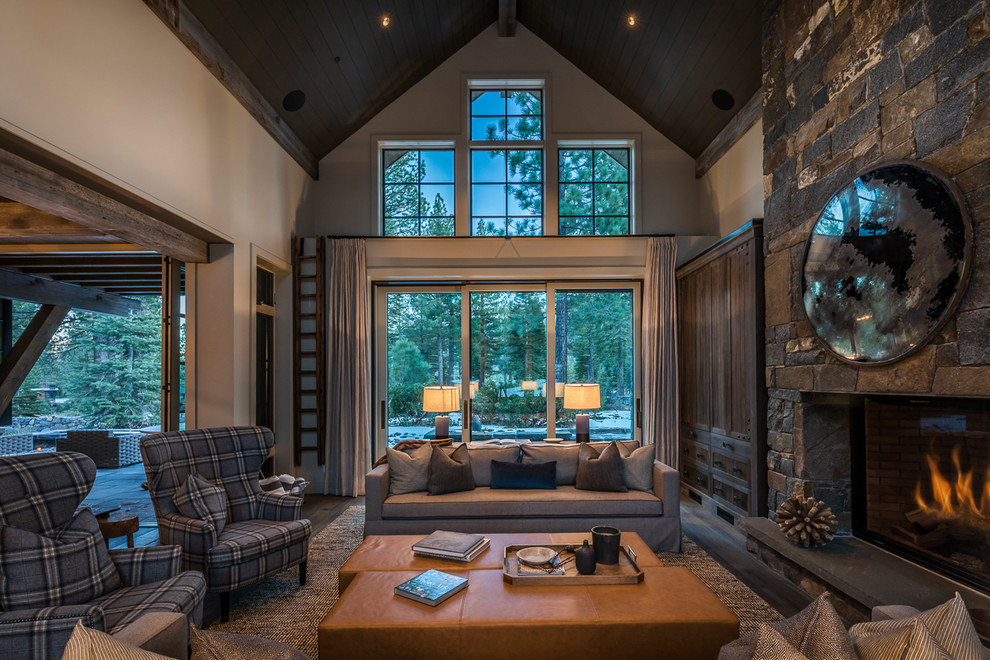 This is an example of a large classic open plan living room in Sacramento with beige walls, light hardwood flooring, a standard fireplace, a stone fireplace surround, no tv and beige floors.