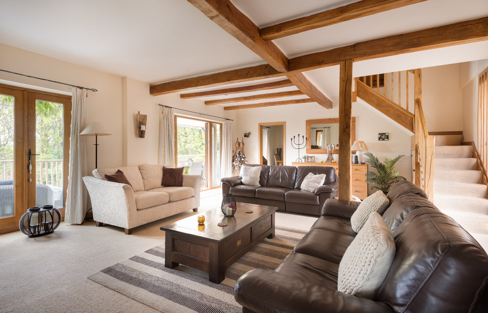 Design ideas for a large rural open plan living room in Devon with beige walls and carpet.