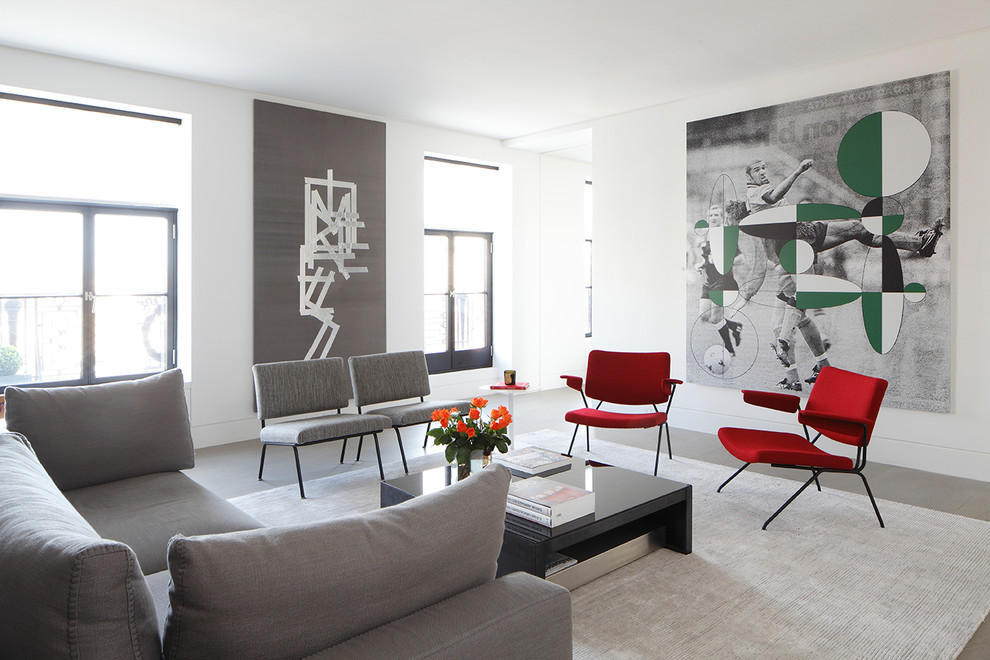 Immagine di un soggiorno moderno di medie dimensioni e chiuso con pareti bianche e pavimento grigio