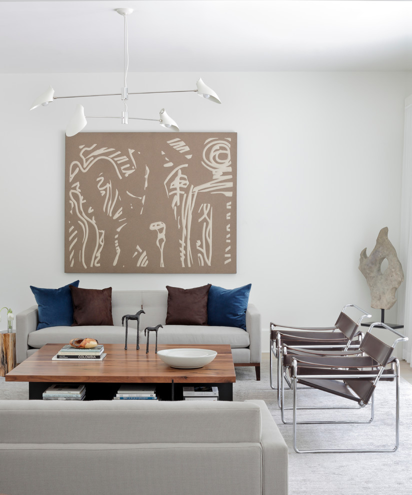 Living room - large transitional open concept light wood floor living room idea in Atlanta with white walls