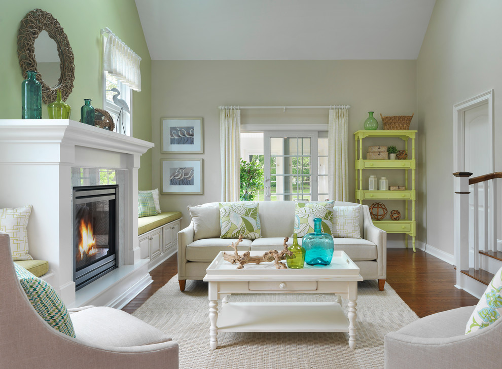 Living room - mid-sized coastal enclosed and formal medium tone wood floor living room idea in Boston with beige walls, a standard fireplace, a stone fireplace and no tv