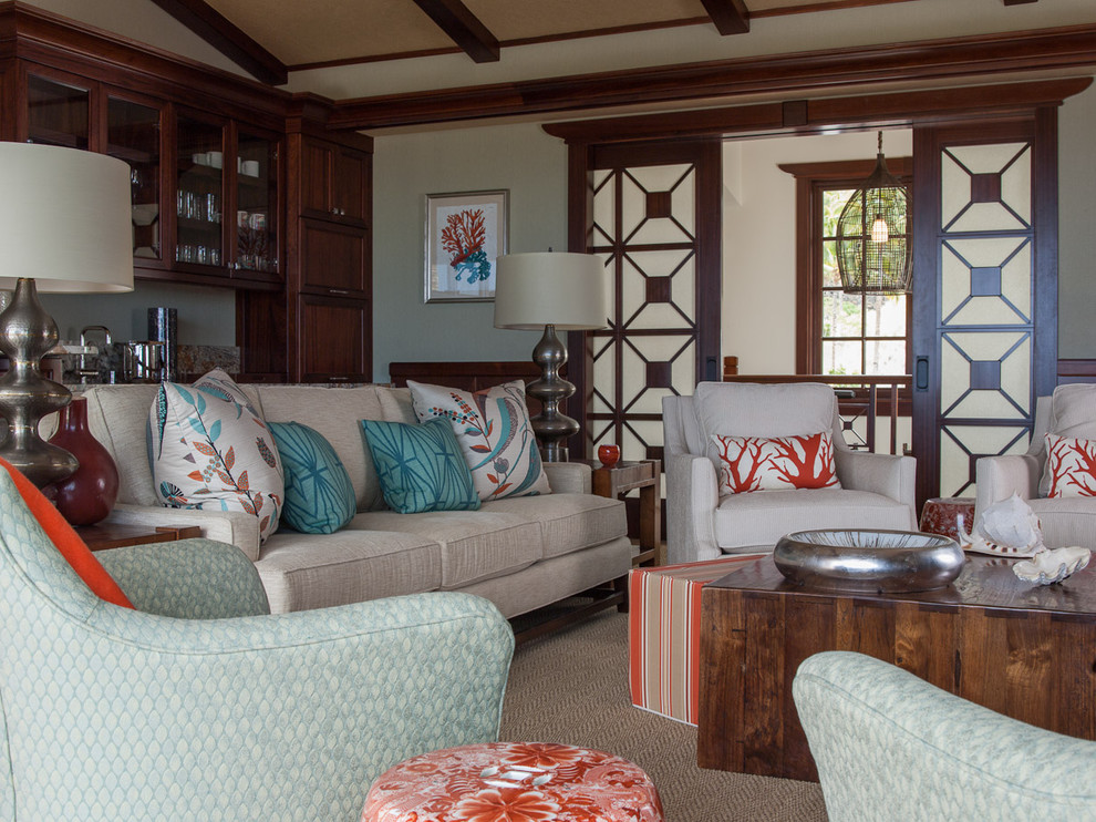 Example of a large island style open concept living room design in Hawaii with white walls and no fireplace