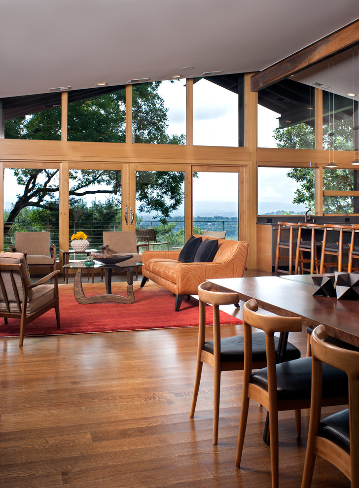 Foto di un grande soggiorno contemporaneo aperto con parquet scuro e pavimento beige