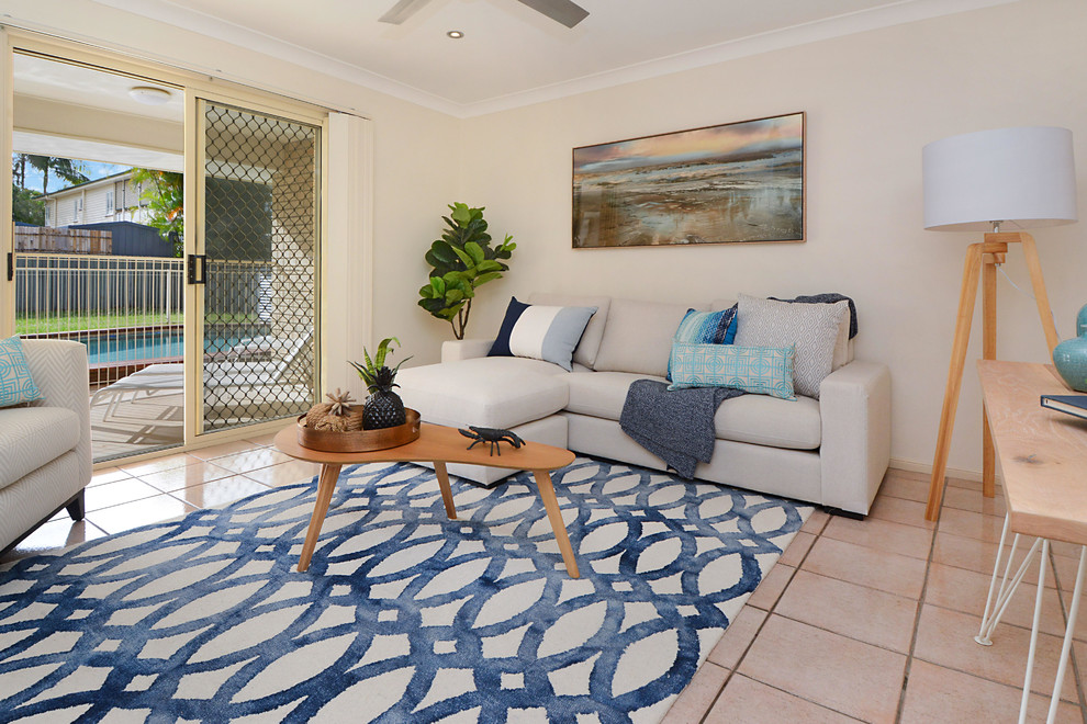 Small beach style formal open plan living room in Brisbane with white walls and ceramic flooring.