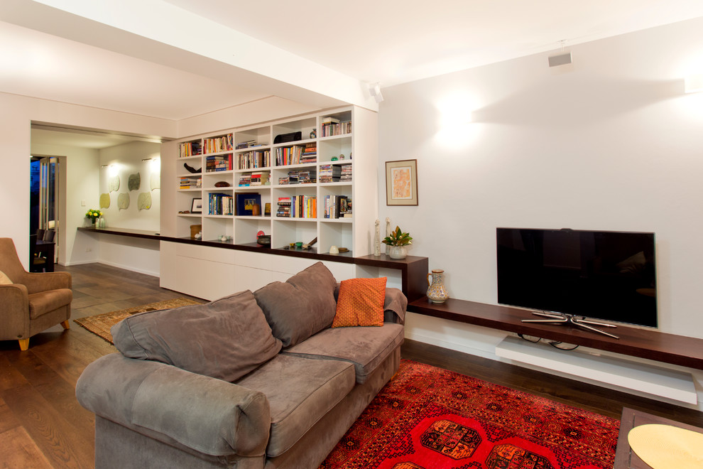 Example of a trendy living room design in Sydney with white walls