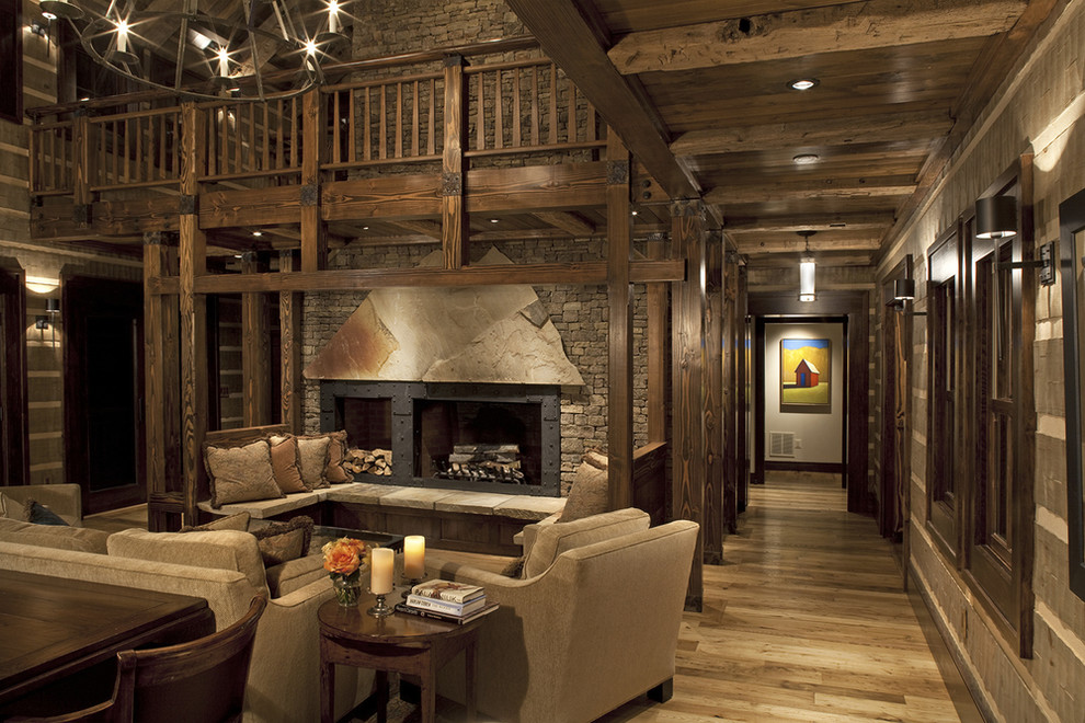 Exemple d'un salon montagne ouvert avec une salle de réception, un sol en bois brun, une cheminée ribbon et aucun téléviseur.