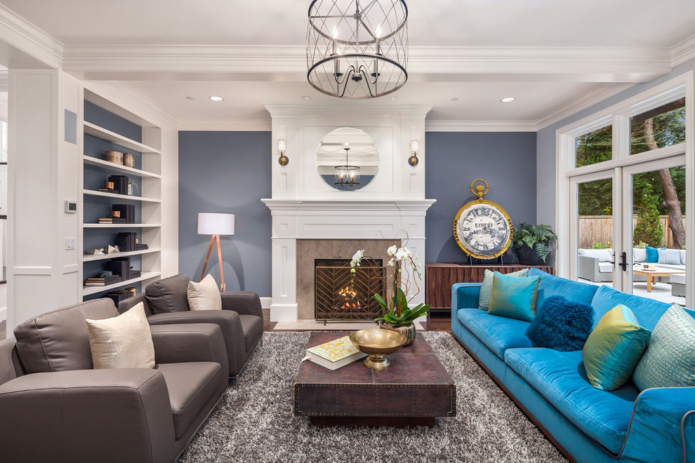Large traditional formal enclosed living room in Seattle with blue walls, dark hardwood flooring, a standard fireplace, a stone fireplace surround and brown floors.