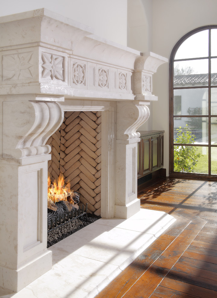 Inspiration for a mediterranean living room remodel in Phoenix with a standard fireplace