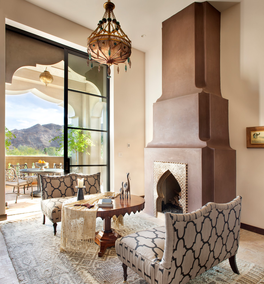 This is an example of a mediterranean living room in Other with beige walls and a standard fireplace.