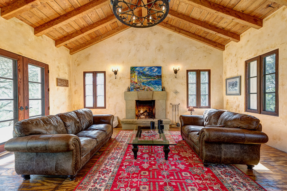 Inspiration for a mediterranean formal living room in Santa Barbara with beige walls and a standard fireplace.