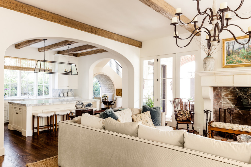 Mediterranean open plan living room in Other with white walls.