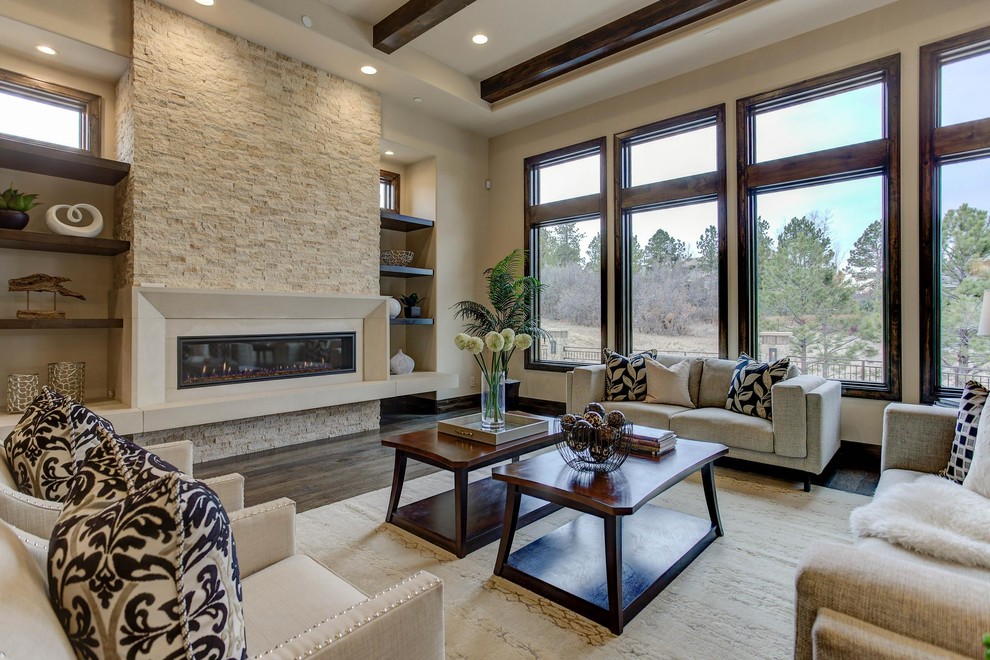 Large mediterranean open plan living room in Denver with beige walls, medium hardwood flooring, a ribbon fireplace, a stone fireplace surround, no tv and brown floors.