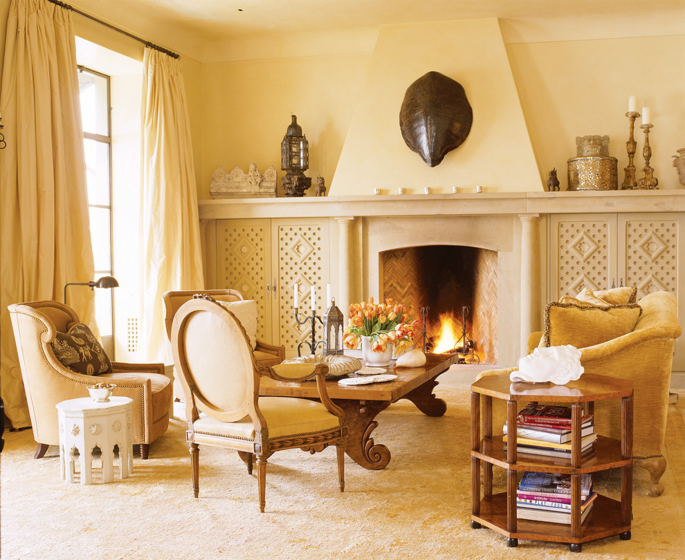 Photo of a mediterranean living room in San Francisco with beige walls, a standard fireplace and no tv.