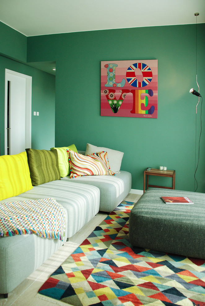 Immagine di un soggiorno moderno di medie dimensioni e chiuso con pareti verdi