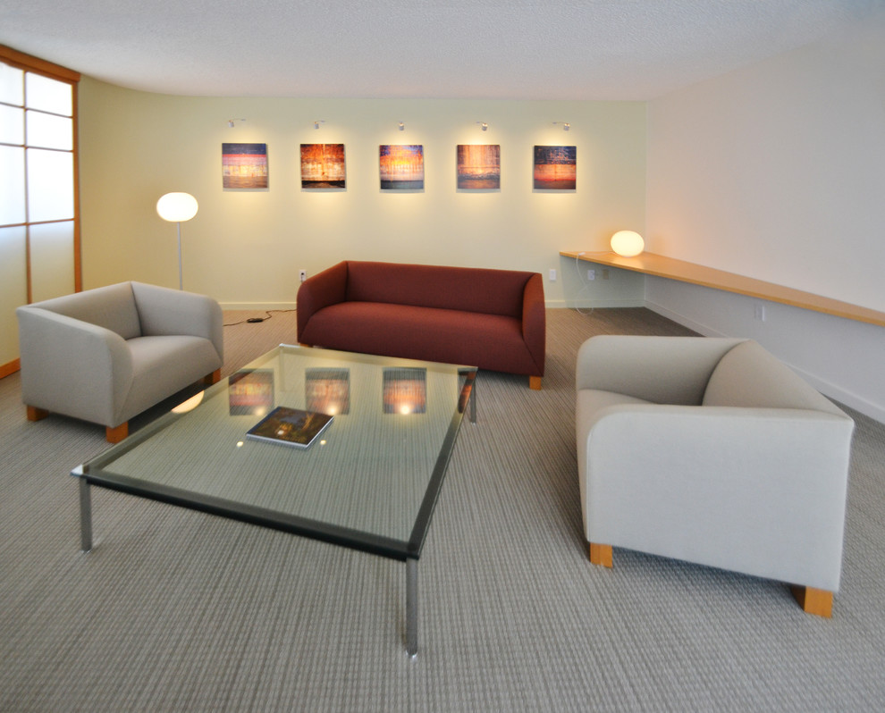 Photo of a modern formal open plan living room in DC Metro with white walls, carpet, no tv and beige floors.