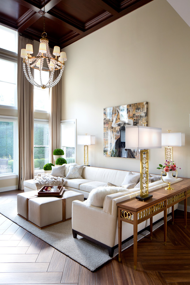 Traditional living room in New York with beige walls, dark hardwood flooring and brown floors.