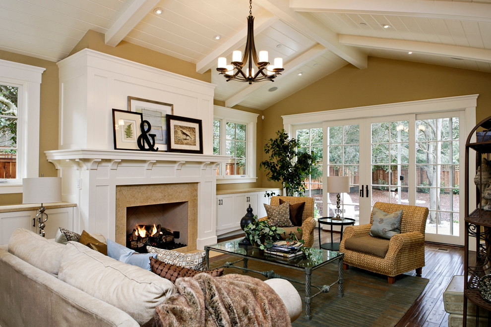 Living room - traditional living room idea in San Francisco with yellow walls, a standard fireplace and no tv