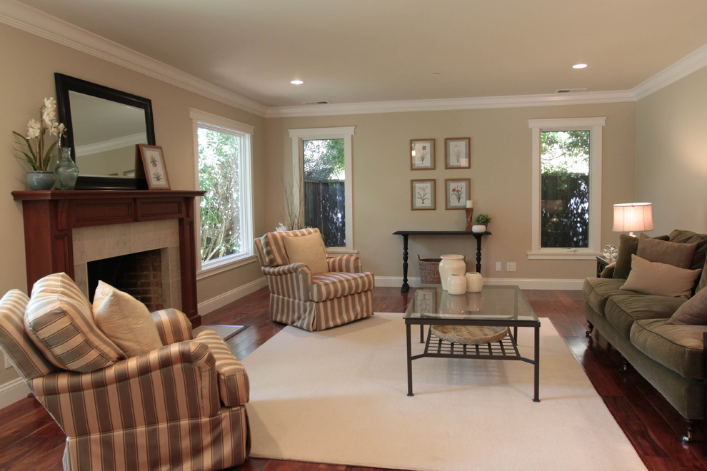 Photo of a traditional living room in San Francisco with beige walls and a standard fireplace.