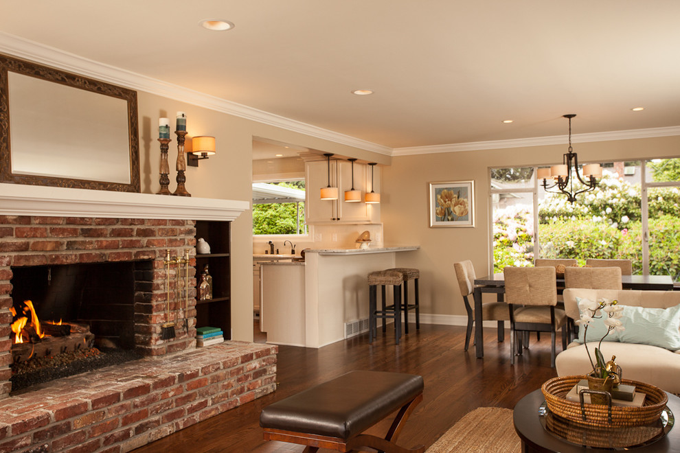 Medium sized classic open plan living room in Seattle with beige walls, a brick fireplace surround, medium hardwood flooring, a standard fireplace and no tv.