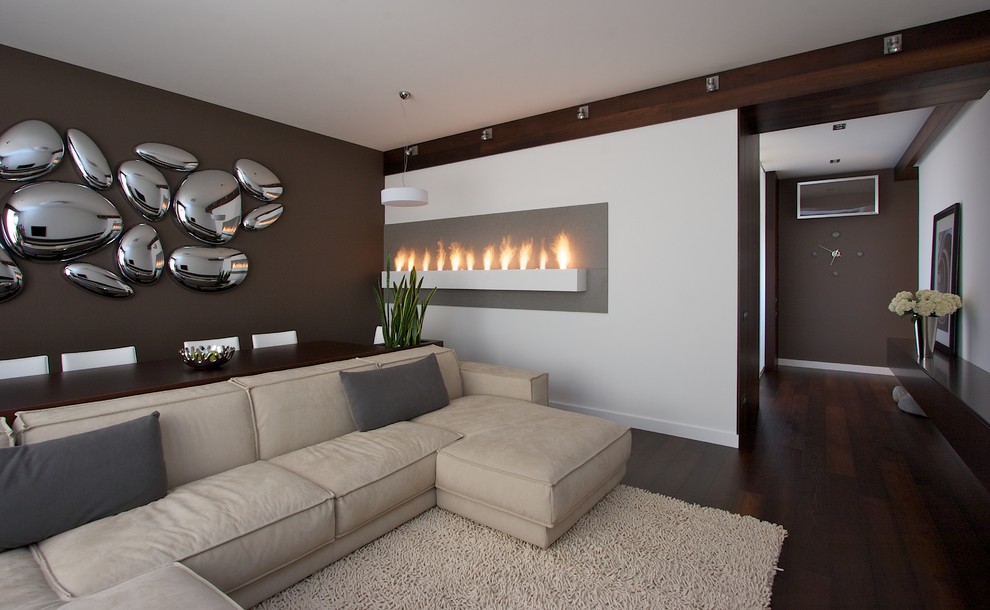 Contemporary living room feature wall in Other with dark hardwood flooring.