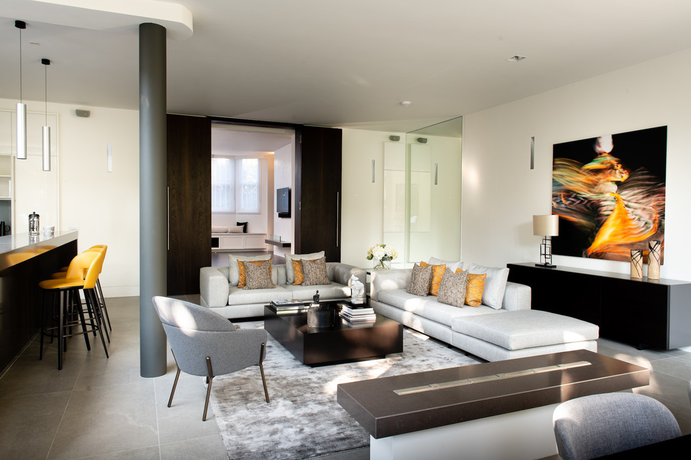 Design ideas for a contemporary living room in London with white walls and grey floors.