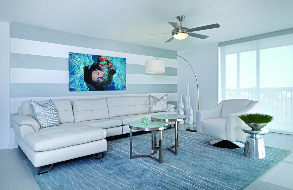 Mid-sized trendy open concept ceramic tile living room photo in Miami with multicolored walls and a wall-mounted tv