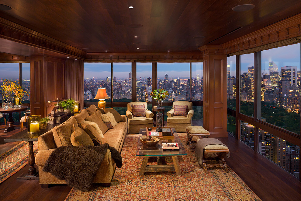 Photo of a traditional living room in New York with dark hardwood flooring.