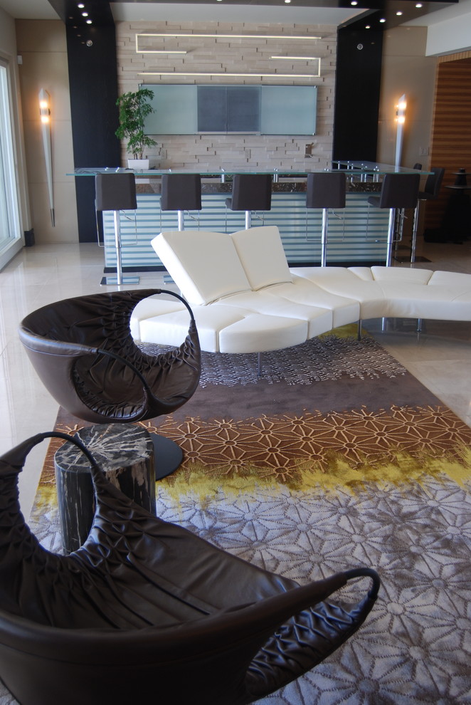 This is an example of a contemporary living room in Miami with a home bar and beige walls.