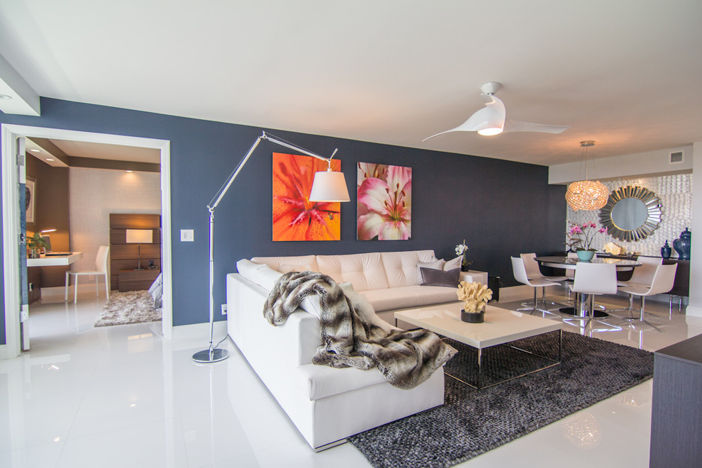 Example of a trendy open concept living room design in Newark with blue walls
