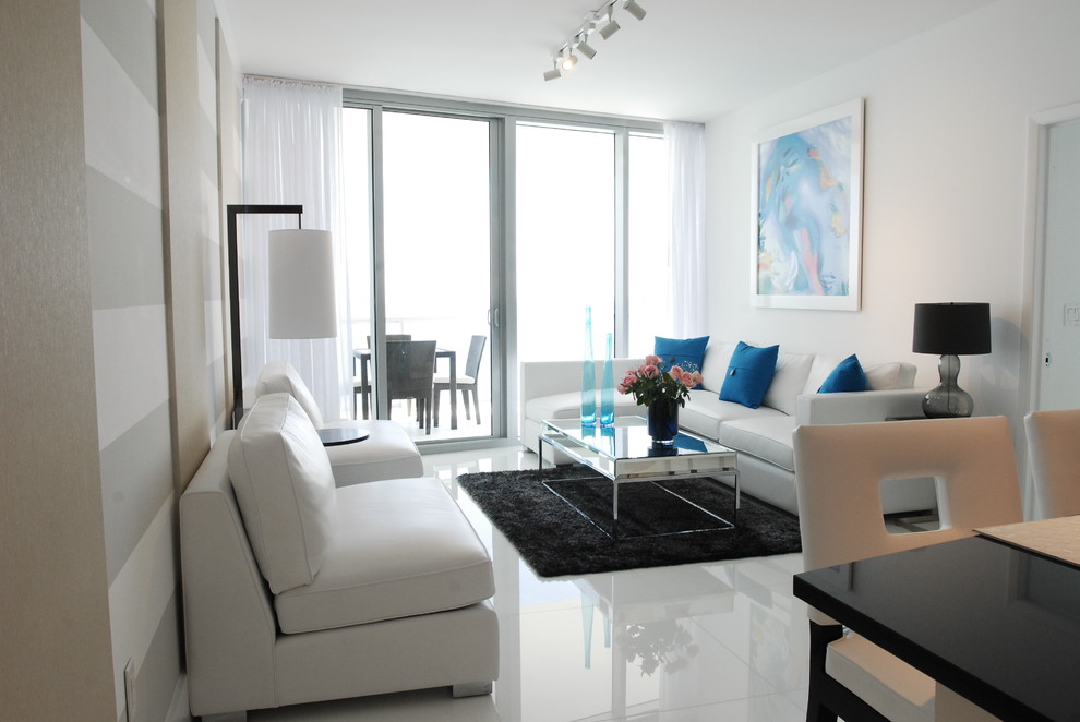 Design ideas for a medium sized contemporary living room in Miami with white walls and white floors.