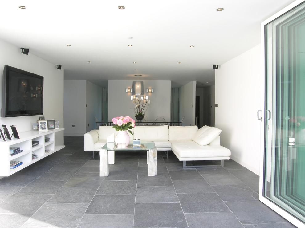 Photo of a medium sized contemporary formal living room in London with white walls, ceramic flooring and a wall mounted tv.