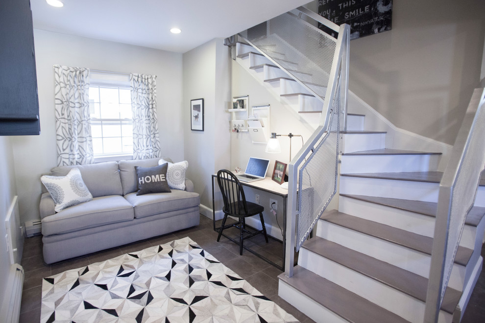 Foto di un piccolo soggiorno minimalista aperto con pareti grigie, pavimento in gres porcellanato, nessun camino e TV a parete