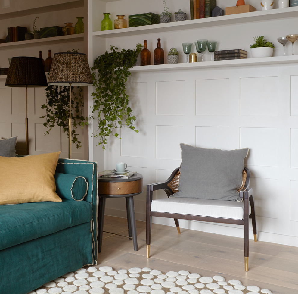 This is an example of a small scandi enclosed living room in London with white walls and medium hardwood flooring.