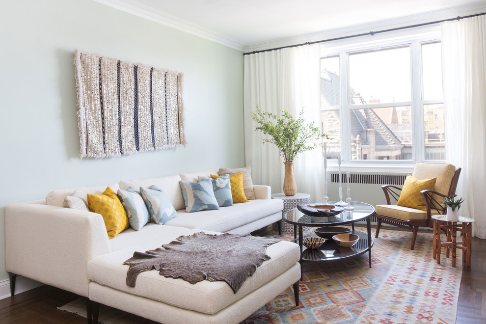 Inspiration for a transitional dark wood floor and brown floor living room remodel in New York with beige walls